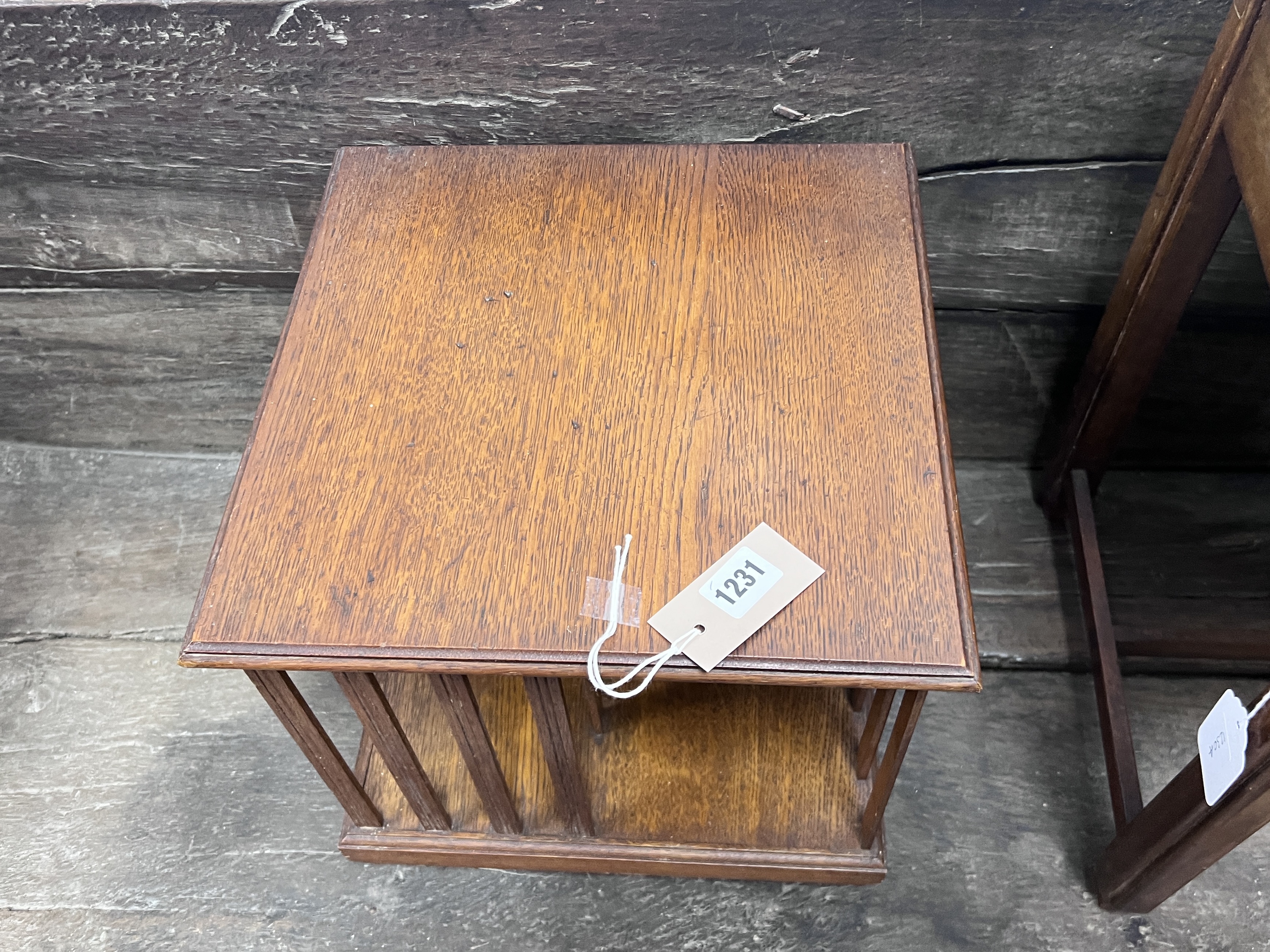 An Edwardian oak table top revolving bookcase, width 33cm, height 32cm